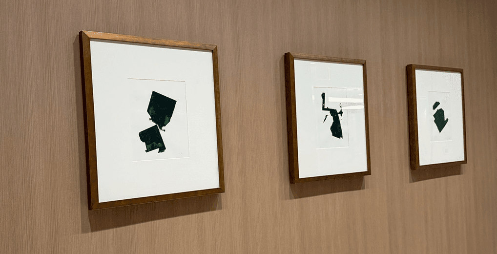 Framed art on wallpapered wall